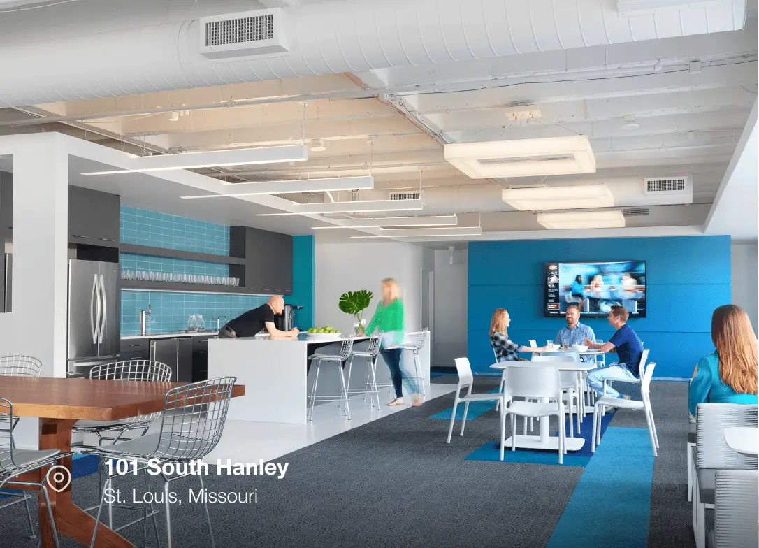 Modern office breakroom: people relax, eat, and work; located at 101 South Hanley, St. Louis, Missouri.