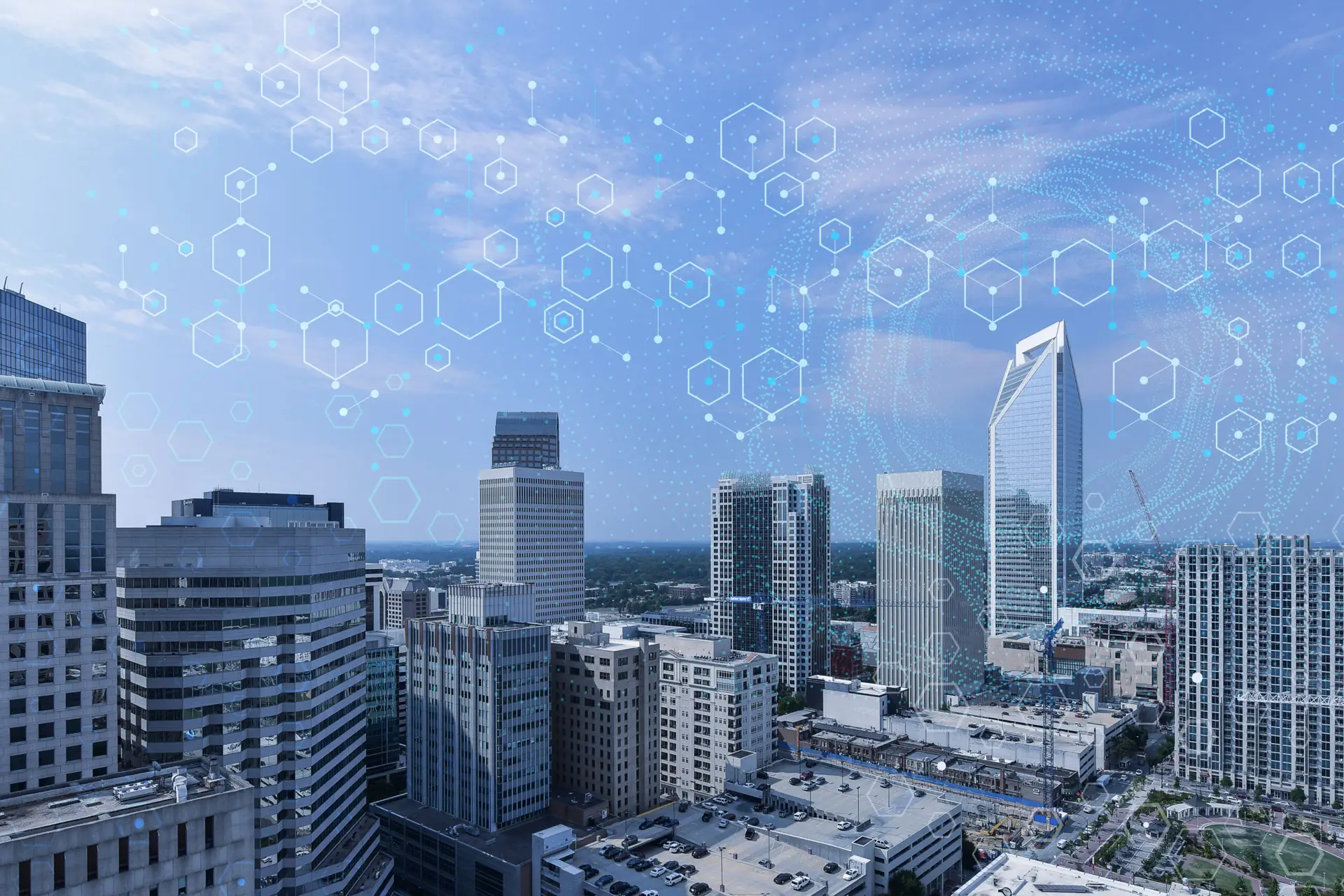 City skyline with futuristic blue network and hexagonal patterns overlay