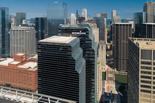 Aerial view of a downtown skyline centered on the Accenture building.