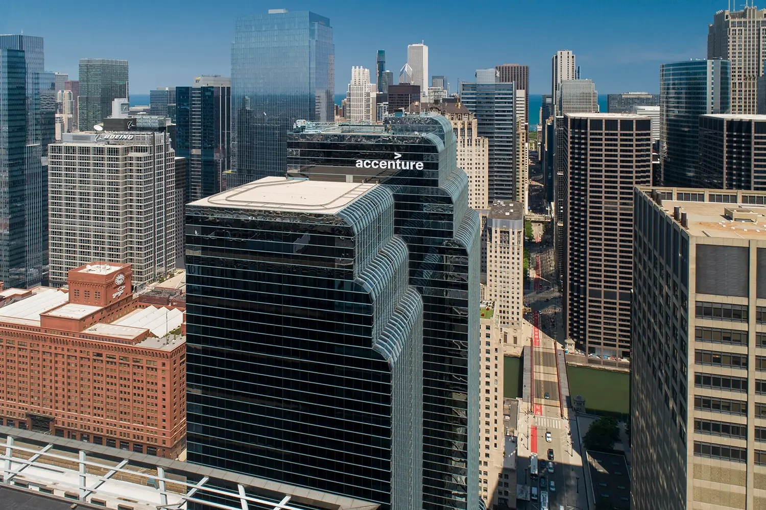 Accenture building stands amidst a cityscape. The building is a skyscraper with a prominent logo.
