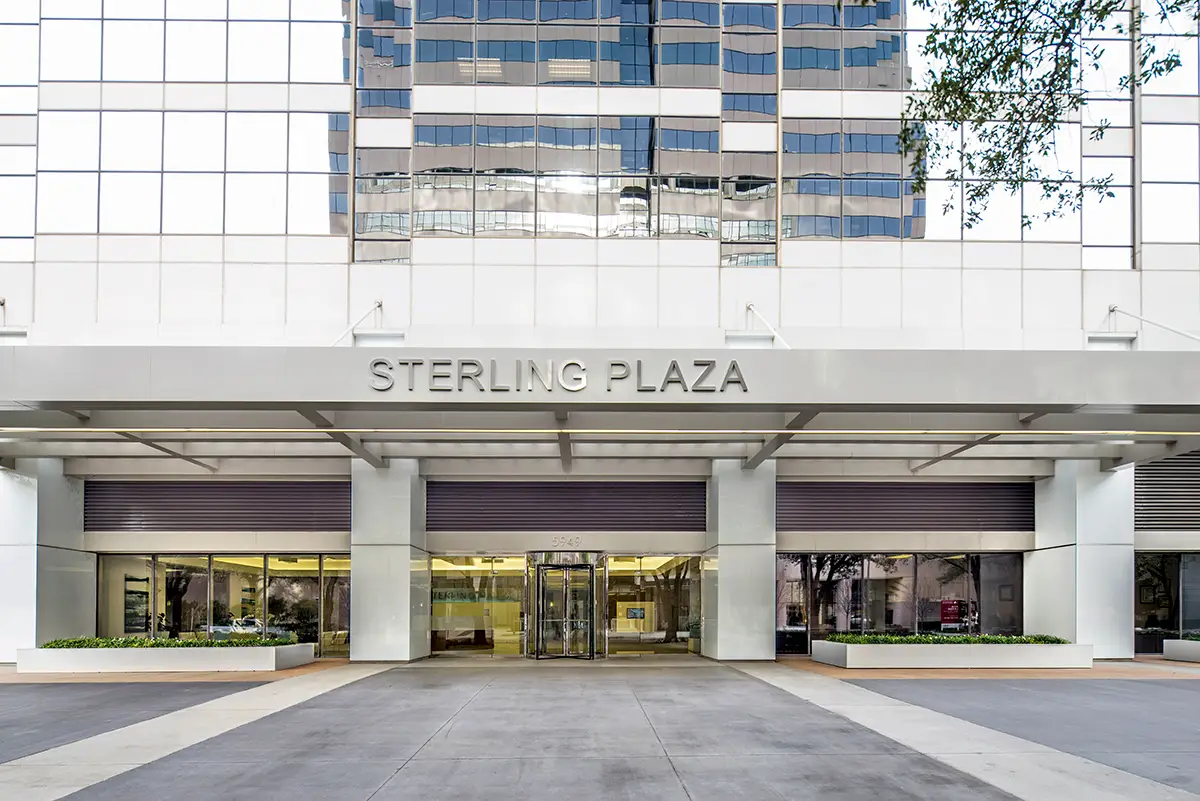 Sterling Plaza building with reflective glass facade and wide entrance