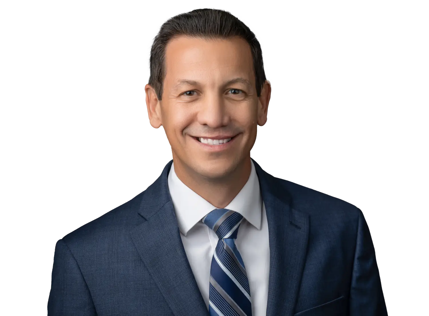 Smiling man in a navy suit and striped tie, studio portrait.