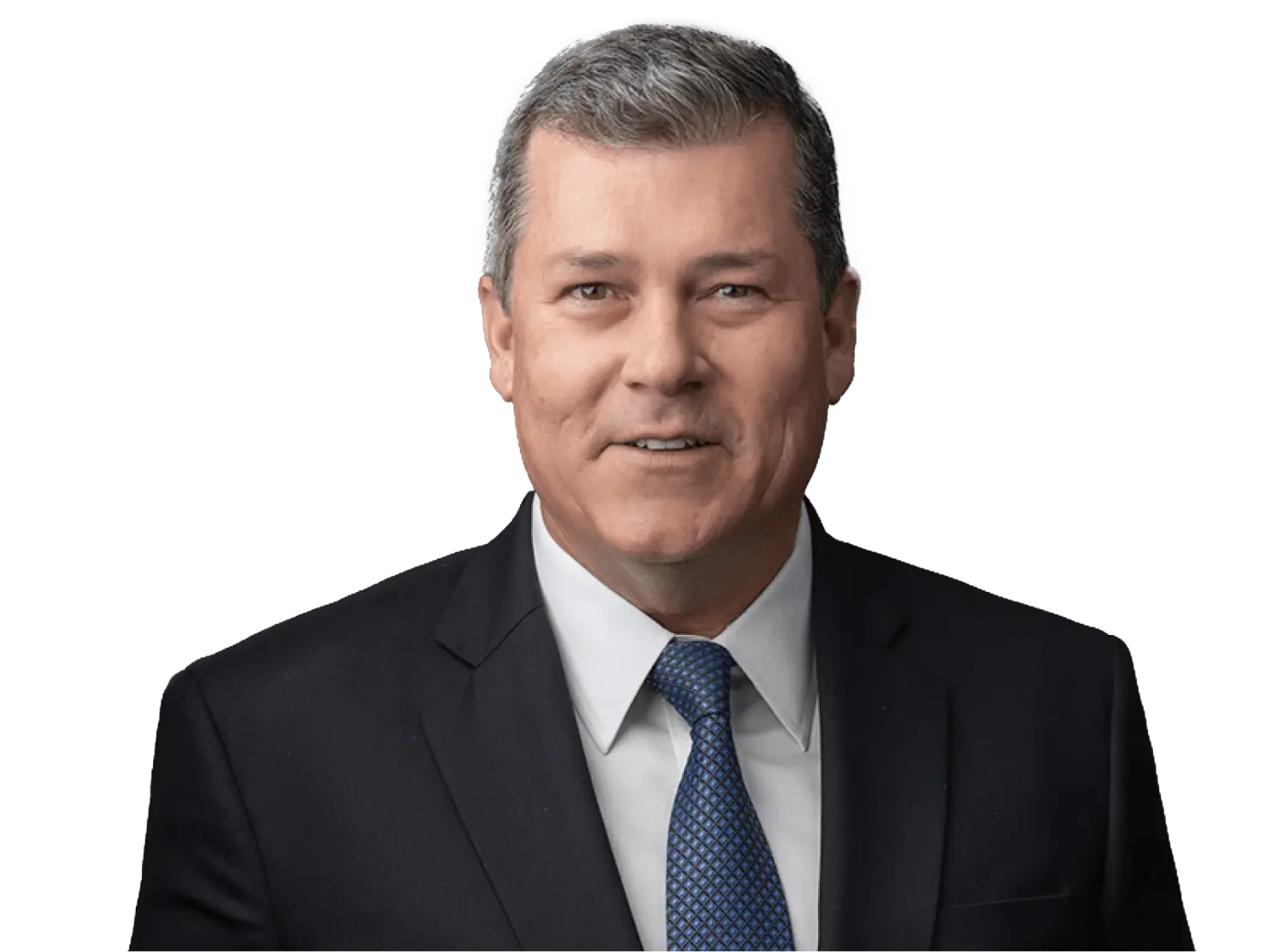 Smiling middle-aged man in a dark suit and blue tie against a black background.