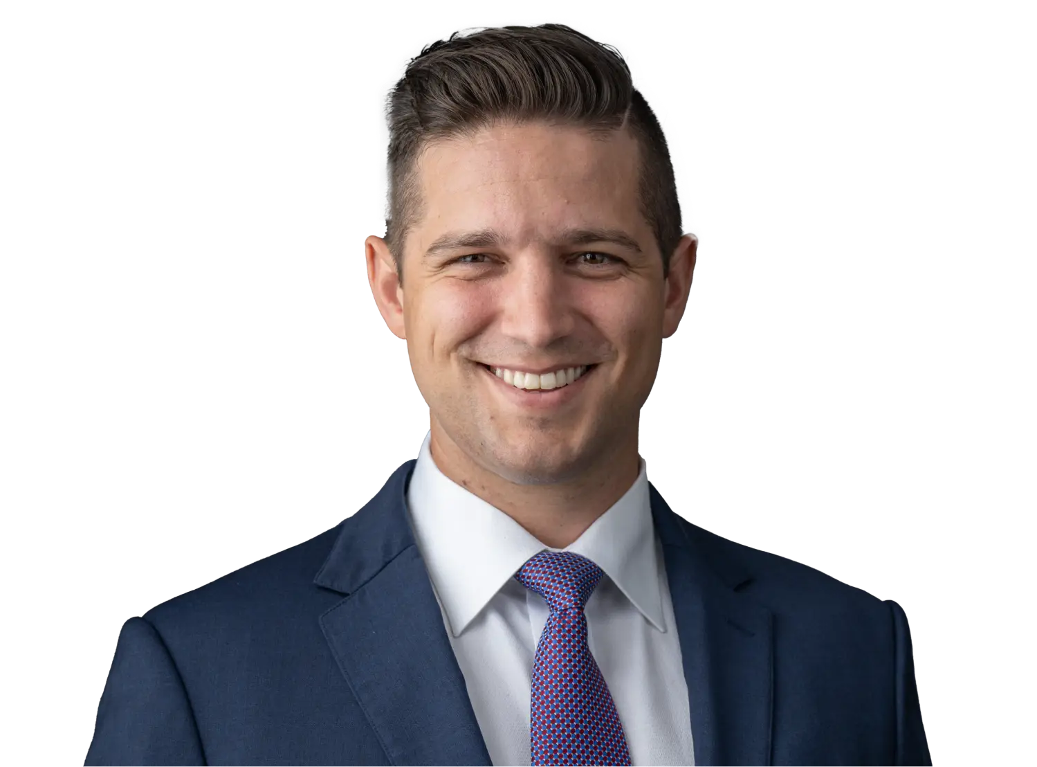 Smiling man in a navy suit, white shirt, and patterned tie, portrait against a black background.