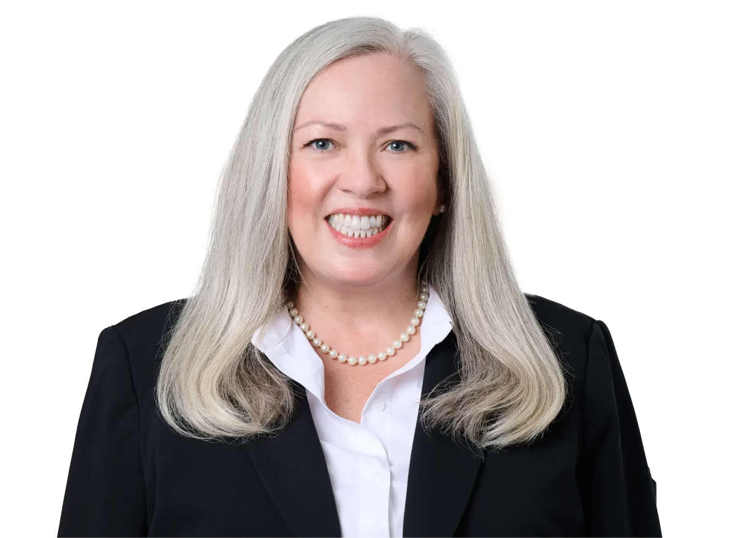 Smiling professional woman with long gray hair, wearing a black blazer and pearl necklace.